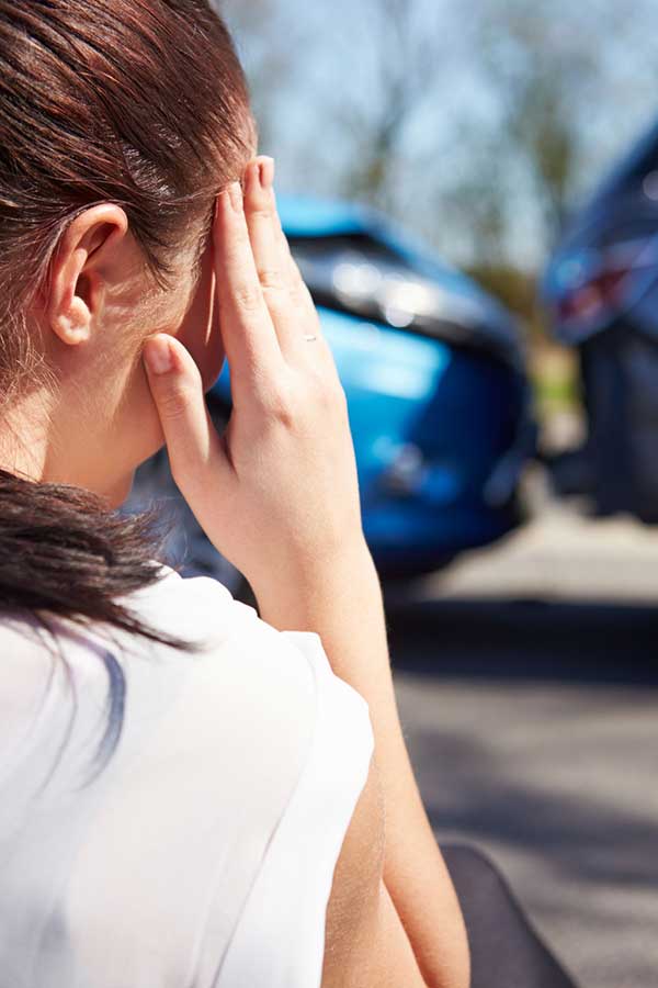 photo of a young female injured in a motor vehicle accident in Alberta, needing the help of an experienced personal injury lawyer specializing in motor vehicle accident claims